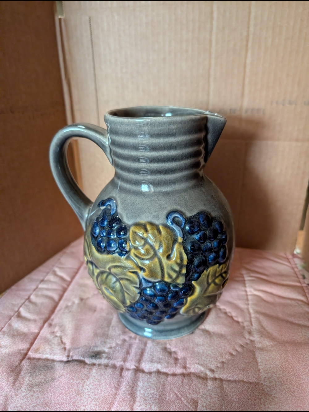 Handcrafted Ceramic Pitcher with Blue Grape Relief